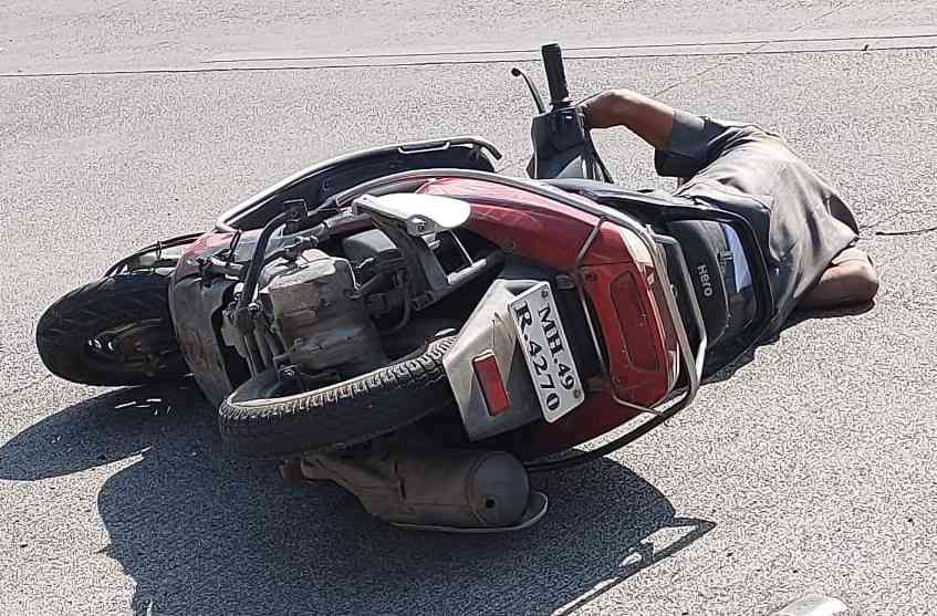 Dinkar Sahane's lifeless body along with his vehicle after the accident